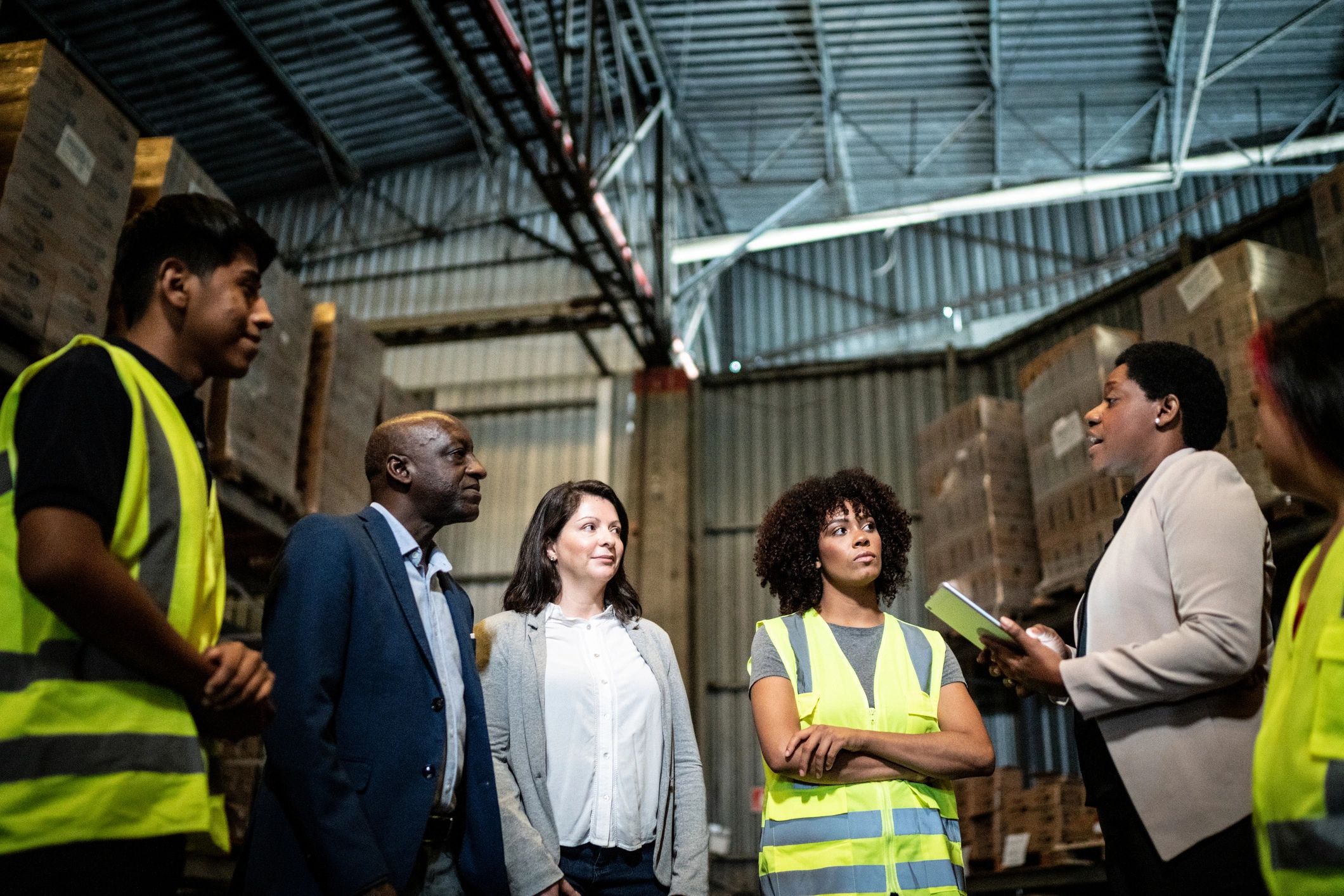 Omni Truck Rentals team collaborating in a warehouse environment